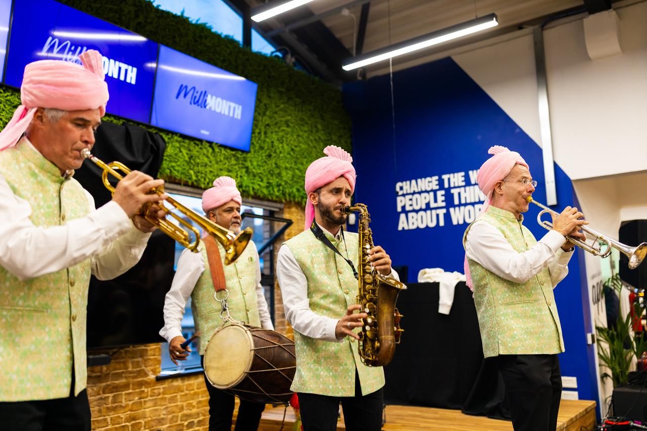 Men playing sax in colourful clothes
